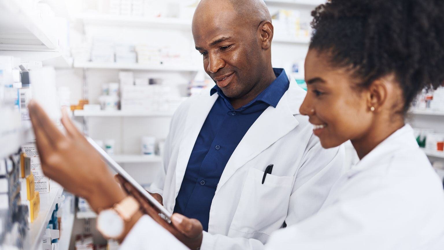 Healthcare, Pharmacist aClinical Pharmacovigilance Service - Clinical - QbD Groupnd Black People or Tablet in Clinic of Medicine Stock, Reading and Check for Label Information. Woman, Man and Digital Telehealth for Medical Inventory, Inspection and Retail